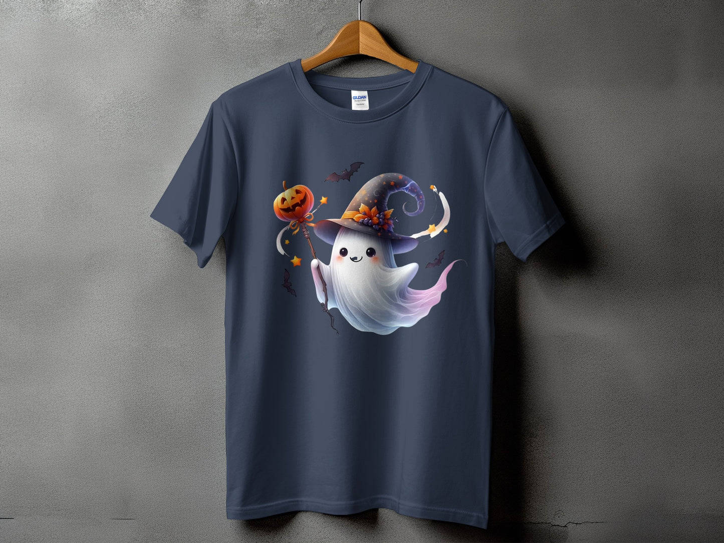 Dark blue t-shirt with a cute ghost in a witch hat holding a pumpkin on a stick.