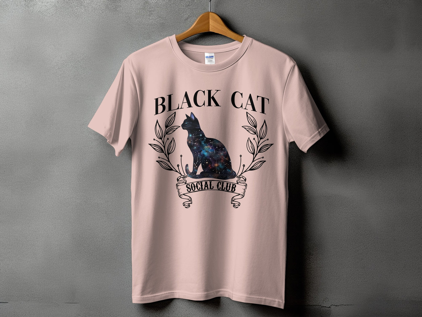 Pink t-shirt with "BLACK CAT SOCIAL CLUB" text and a galaxy cat graphic.