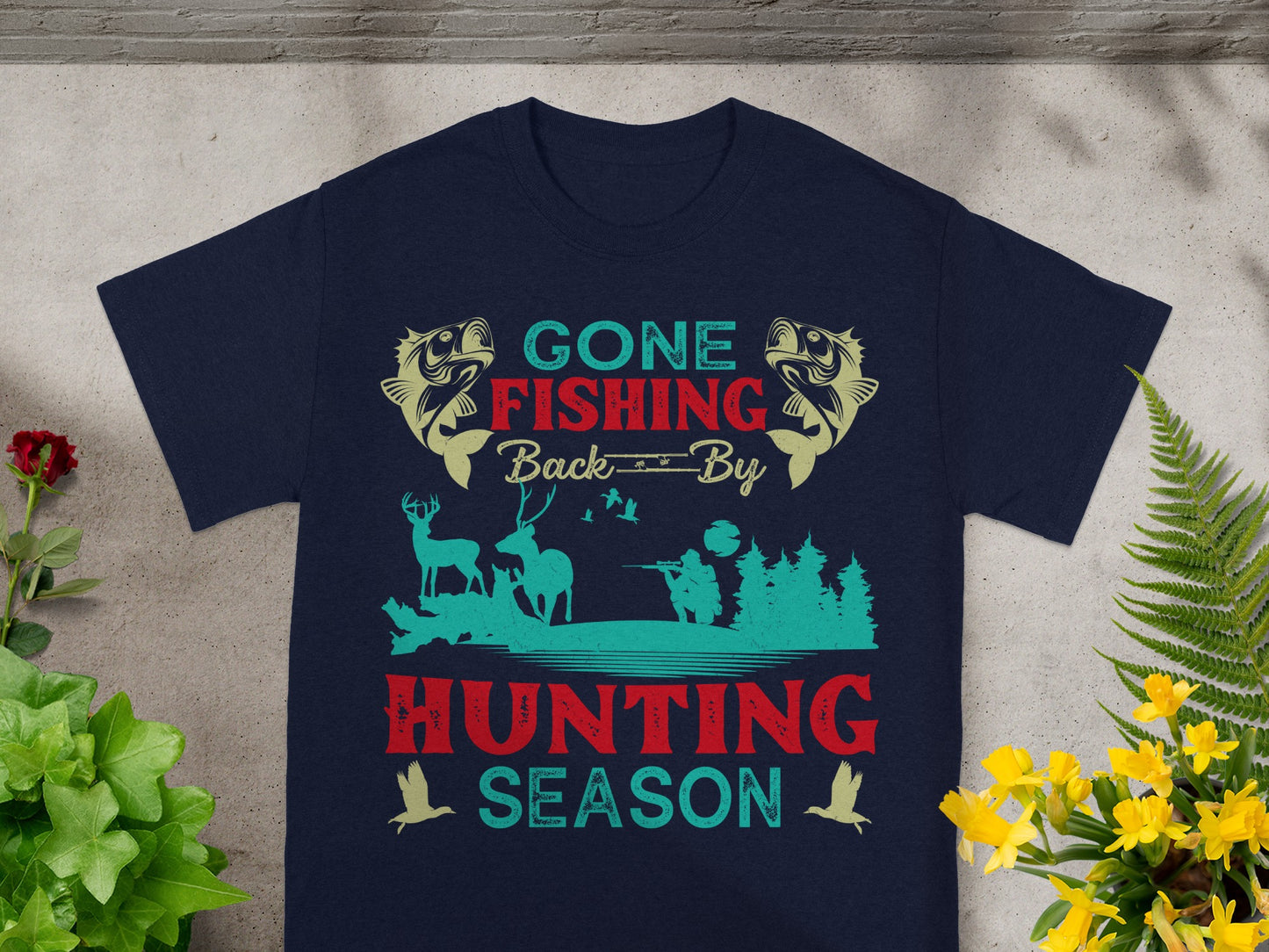 Navy t-shirt with "Gone Fishing Back By Hunting Season" text and fishing/hunting graphics.