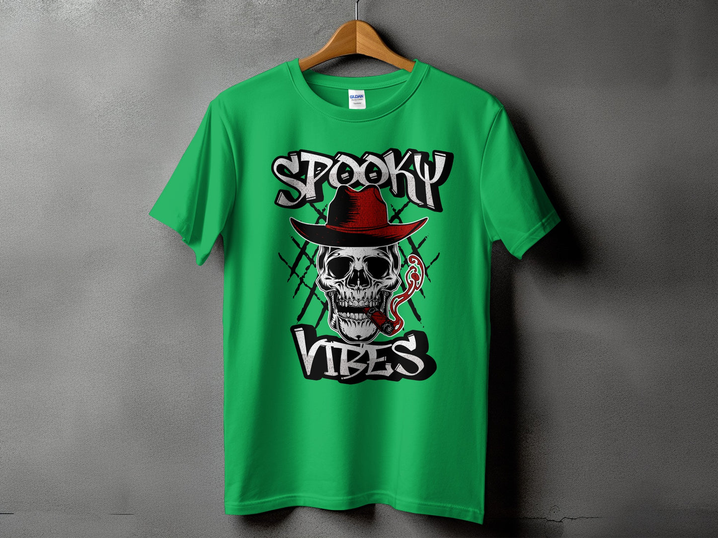 Green t-shirt with a skull in a hat smoking a cigar and text "Spooky Vibes".