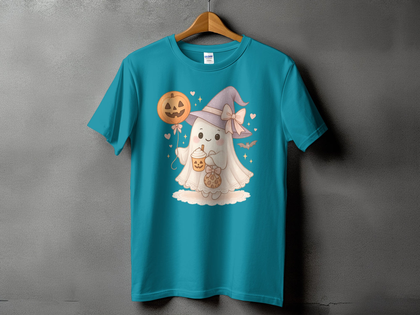 Teal t-shirt with a Halloween ghost holding a pumpkin balloon and drink.