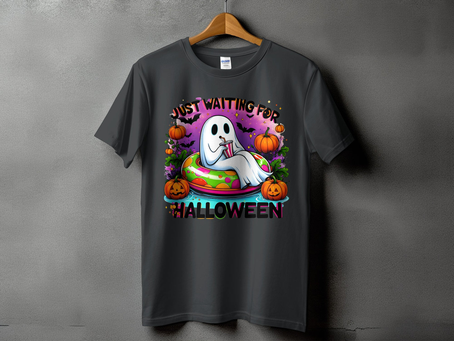 Ghost in a float with pumpkins, bats, and text "JUST WAITING FOR HALLOWEEN".
