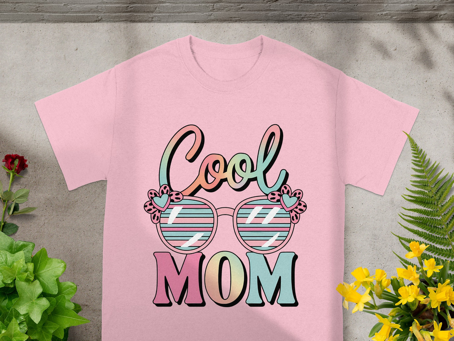 Pink t-shirt with "Cool MOM" text and sunglasses graphic.