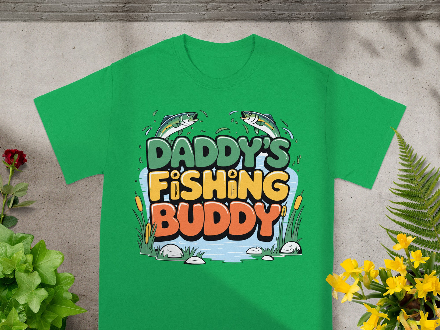 Green t-shirt with "DADDY'S FISHING BUDDY" text and cartoon fish.