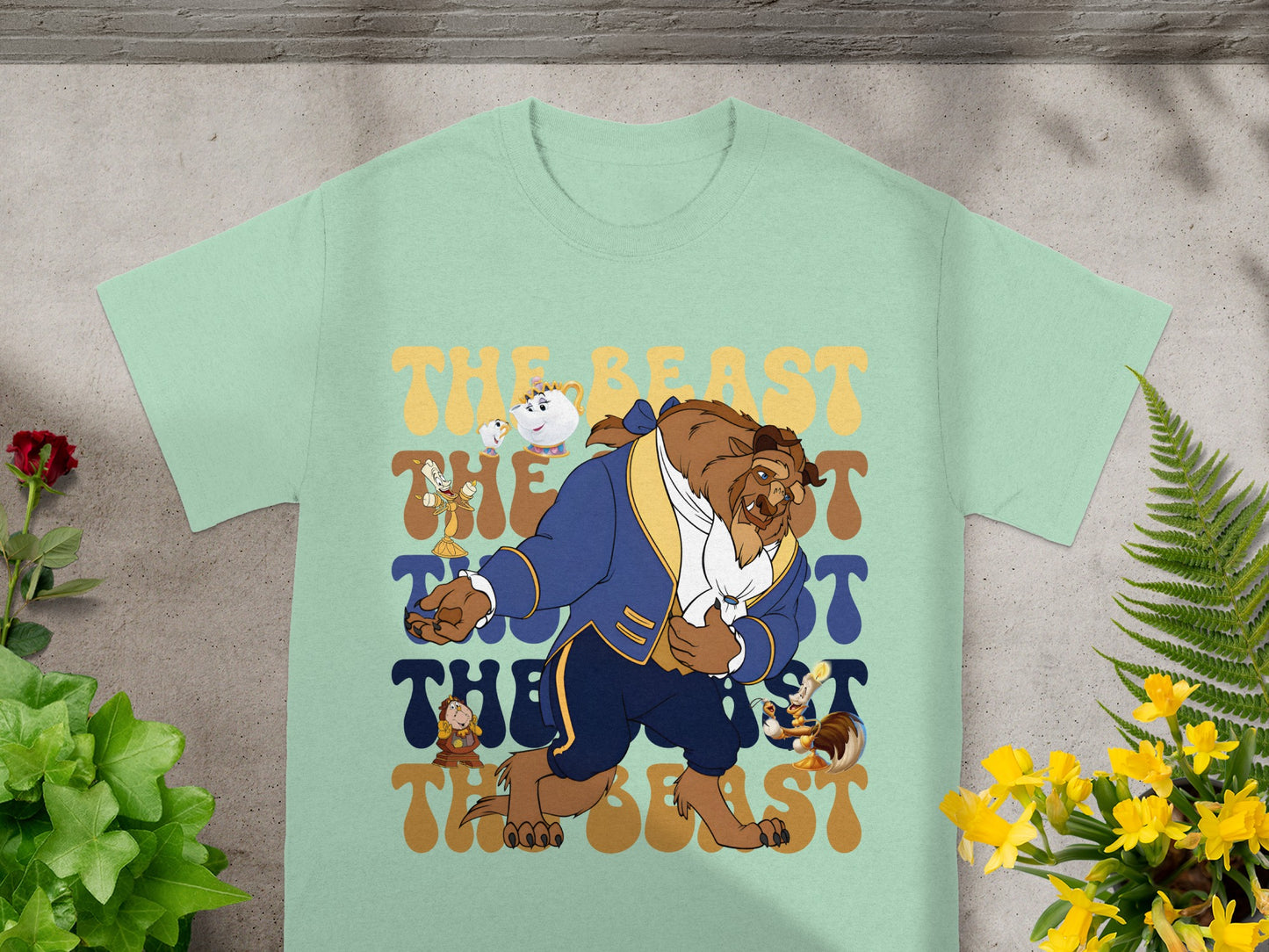 The Beast from Beauty and the Beast on a light green t-shirt.
