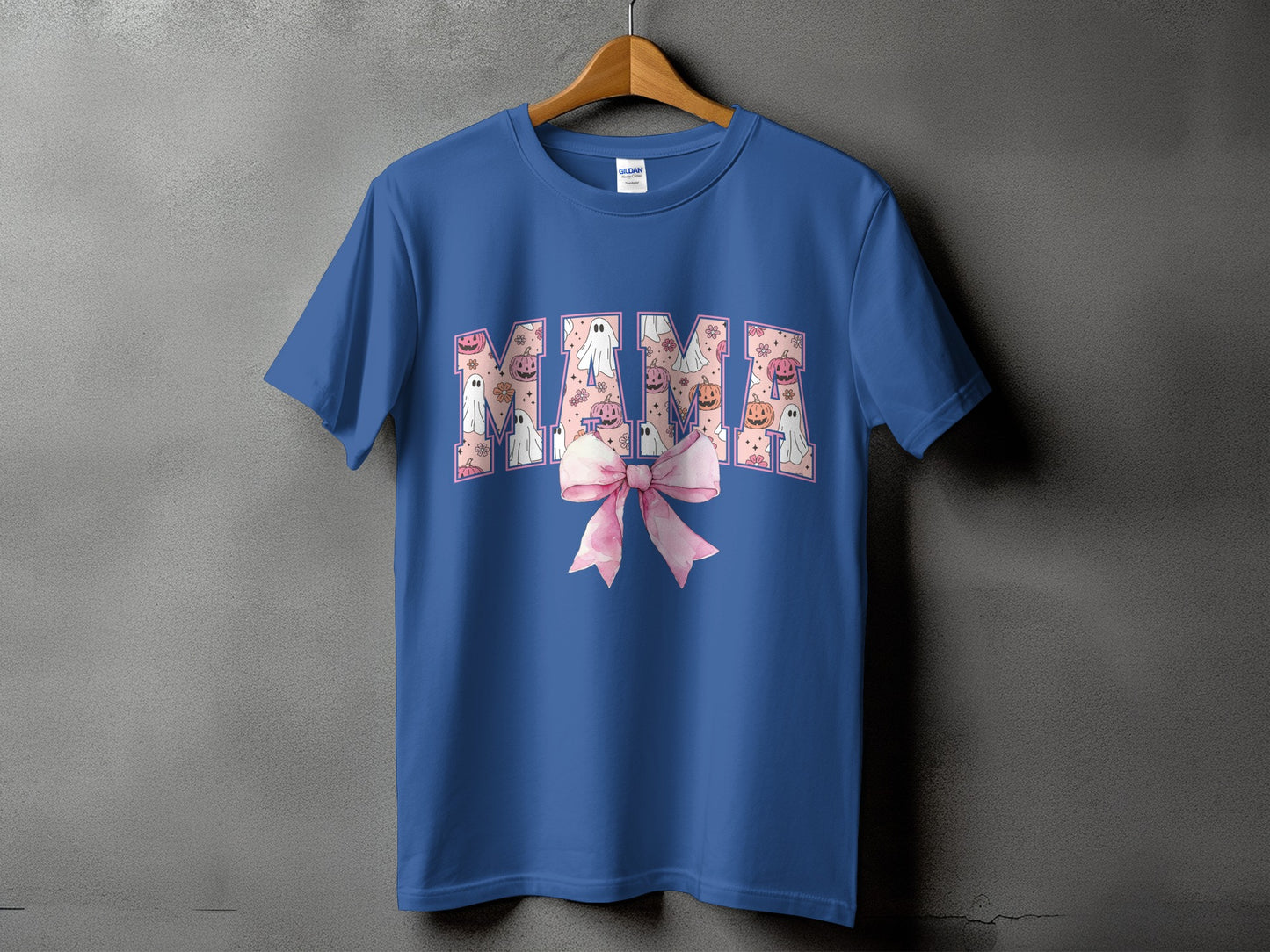 Blue t-shirt with "MAMA" in a pattern of ghosts, pumpkins, and flowers.