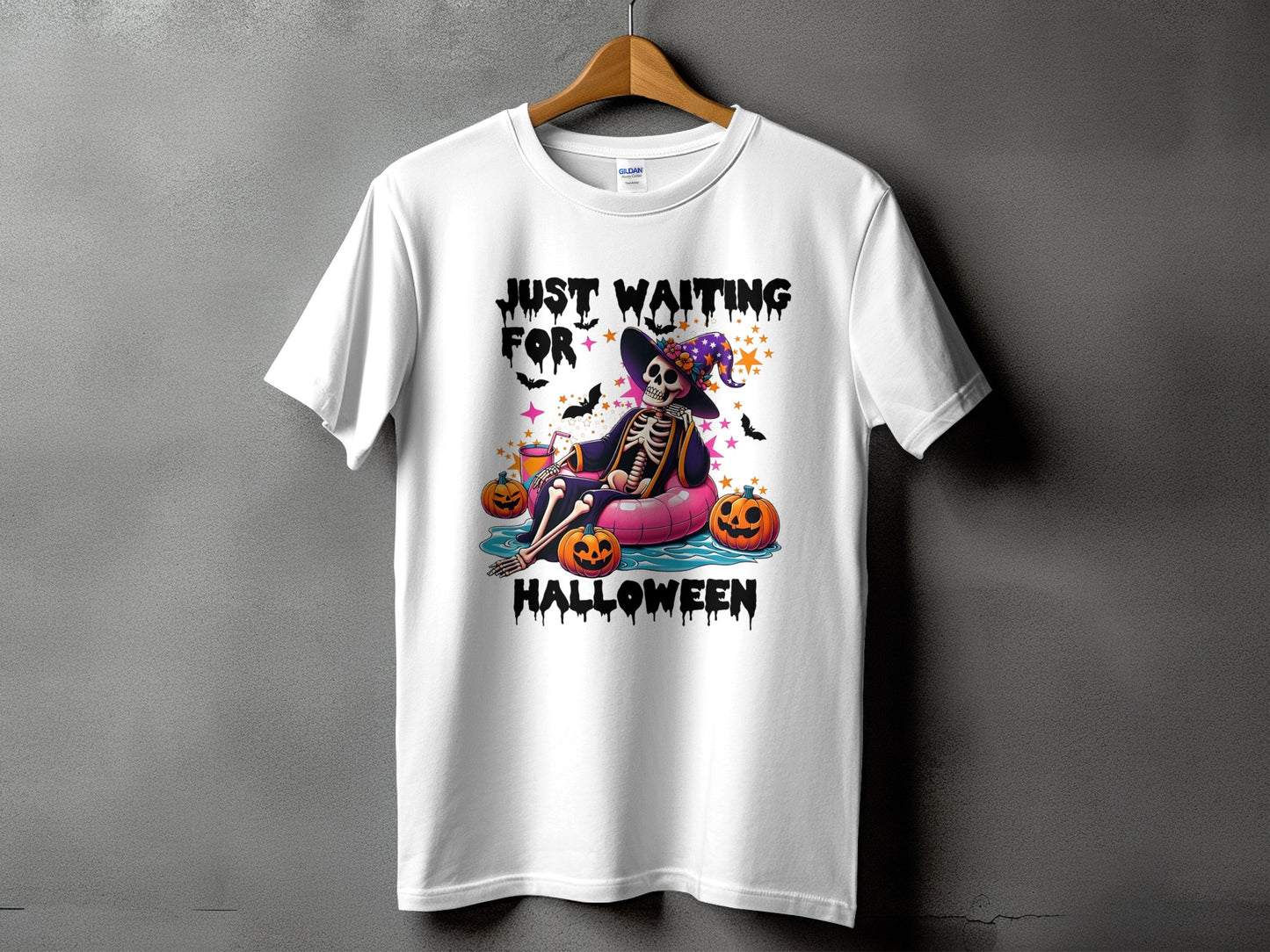 White t-shirt with skeleton graphic and text "JUST WAITING FOR HALLOWEEN".