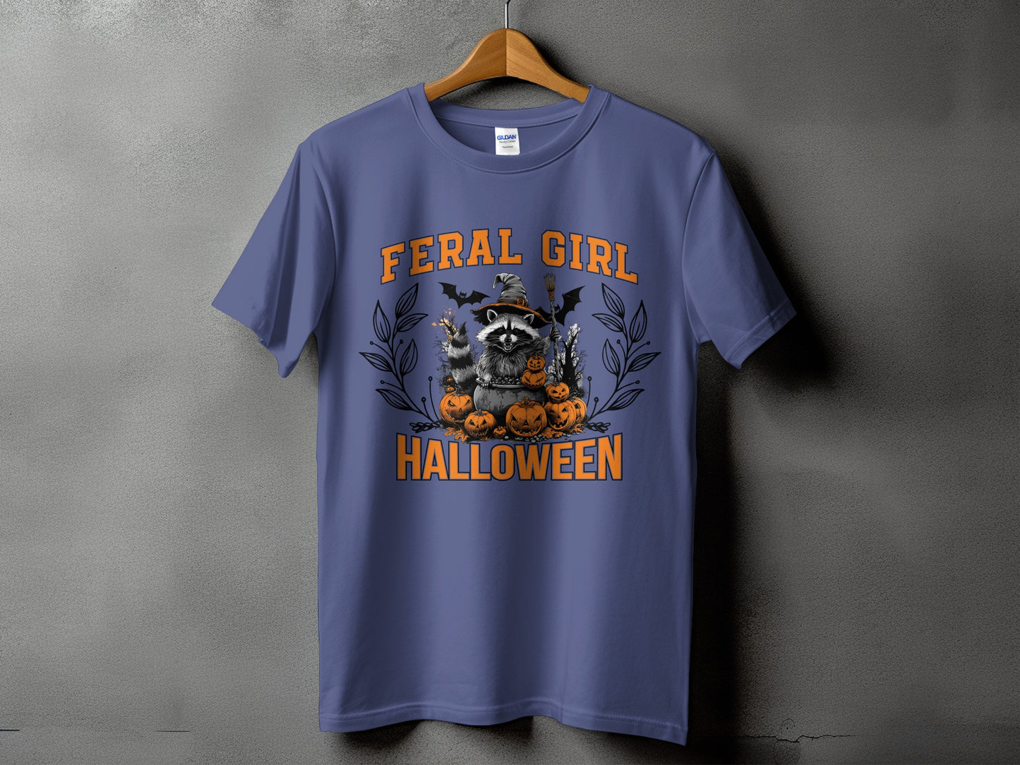 Feral Girl Halloween text with raccoon in witch hat and pumpkins graphic.