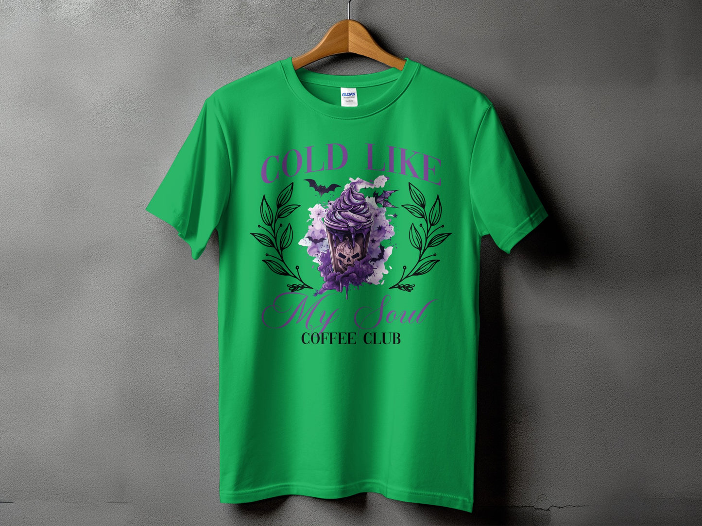 Green t-shirt with "Cold Like My Soul Coffee Club" text and skull design.