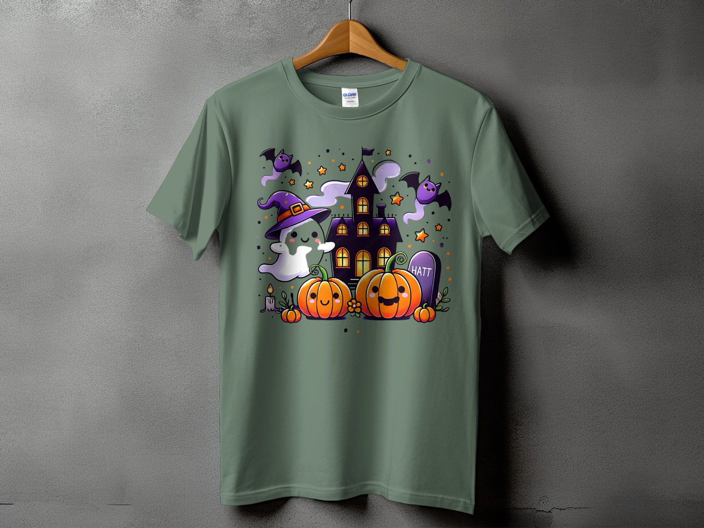 Halloween t-shirt with cartoon ghost, pumpkins, bats, and haunted house.