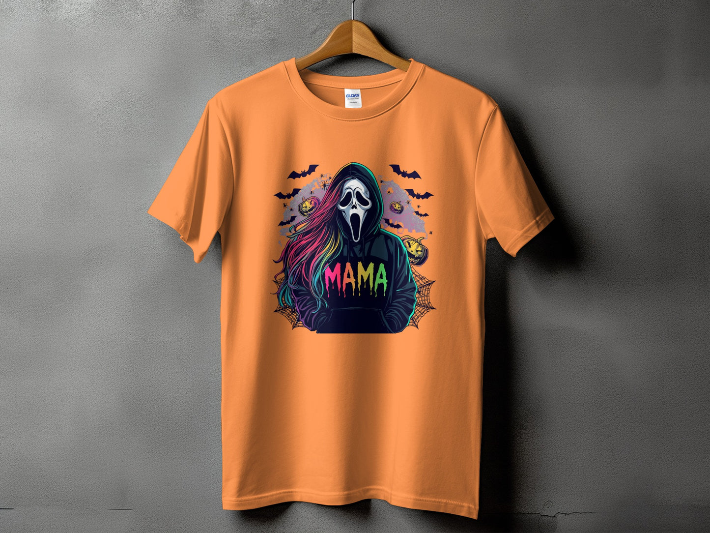 Orange t-shirt with a spooky ghost and "Mama" text graphic.