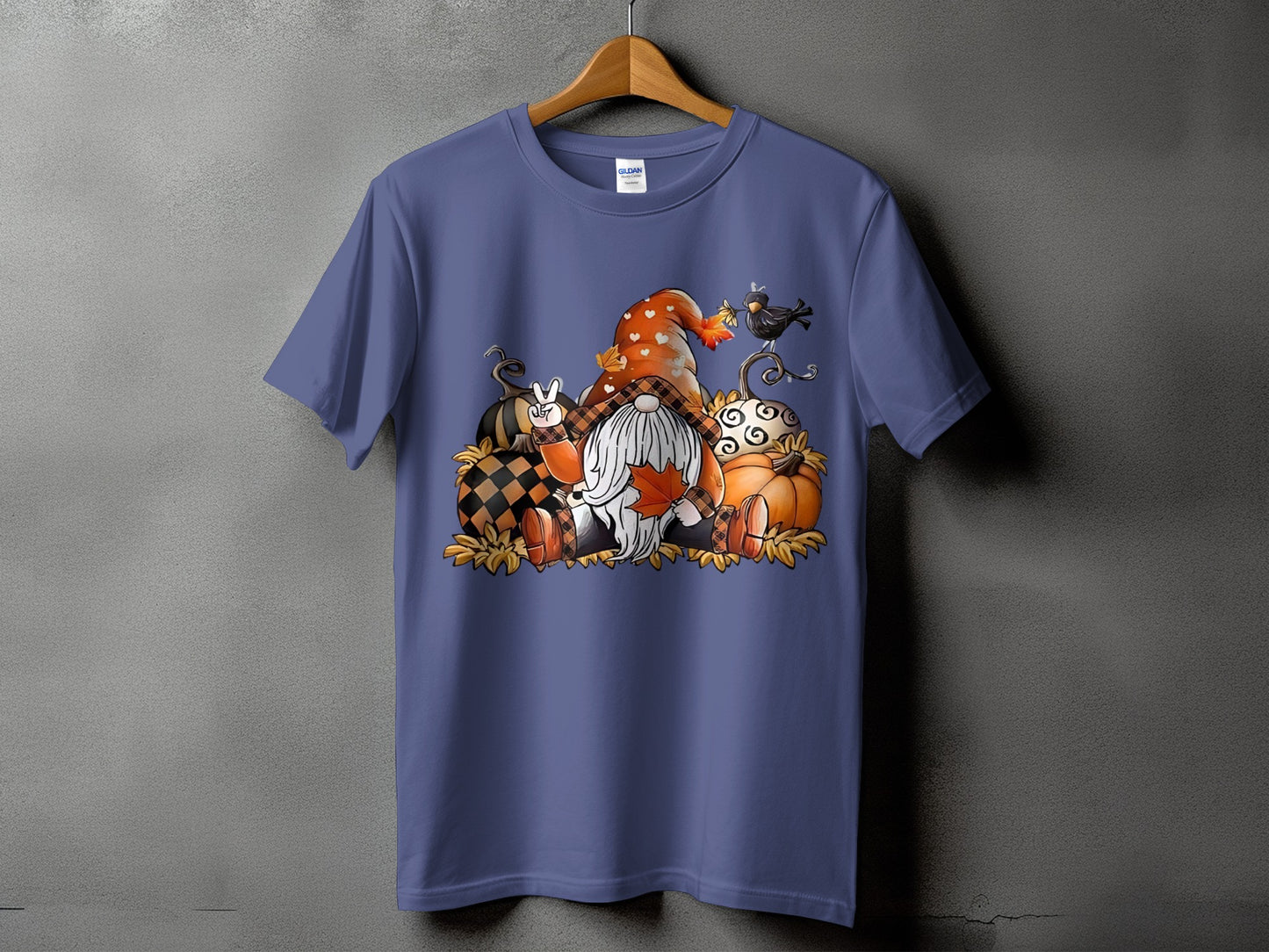 Gnome and pumpkins fall graphic on a purple t-shirt.
