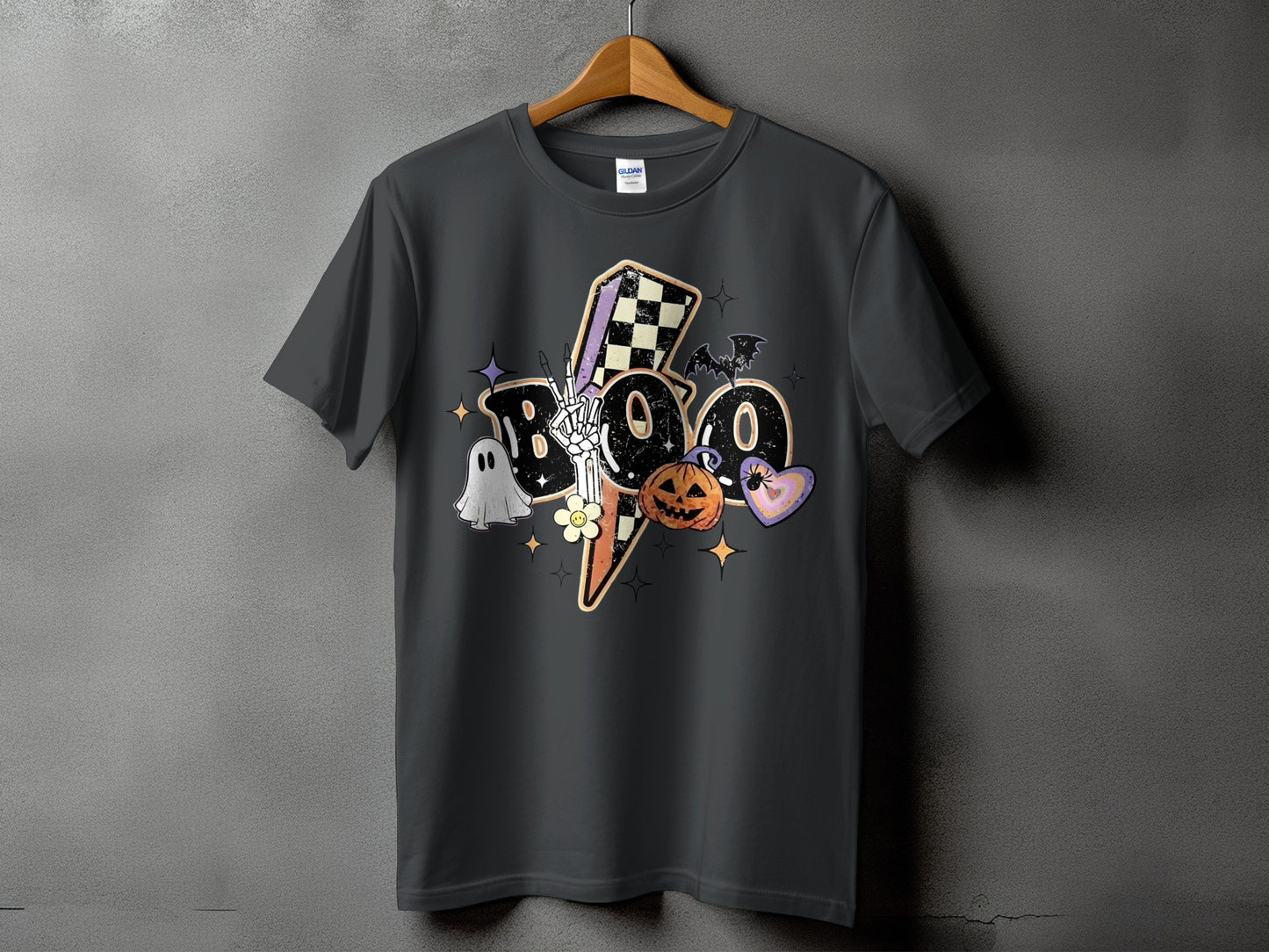 Dark grey t-shirt with a "BOO" Halloween graphic featuring a ghost, pumpkin, bat, and checkered lightning bolt.