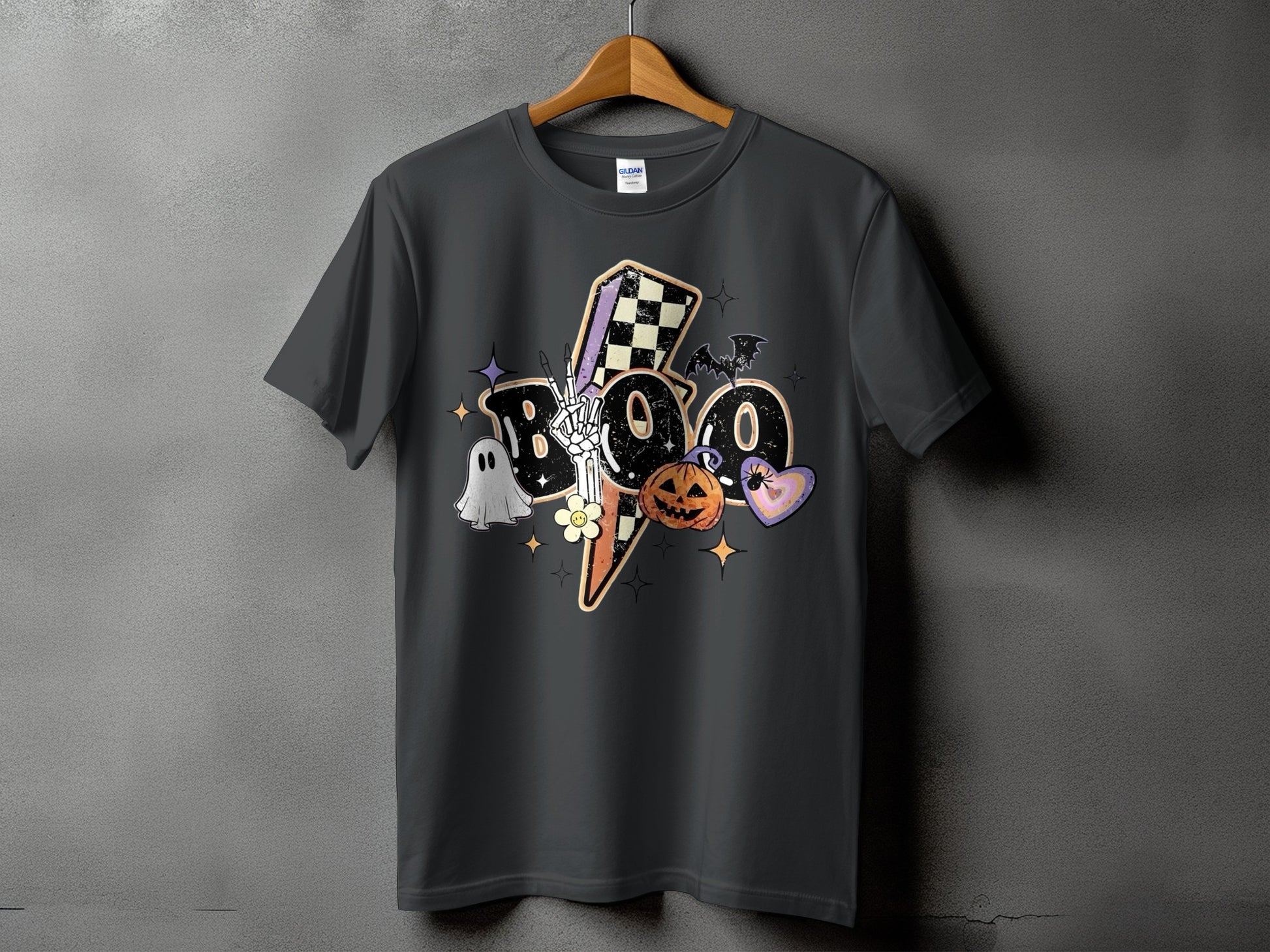 Dark grey t-shirt with a "BOO" Halloween graphic featuring a ghost, pumpkin, bat, and checkered lightning bolt.