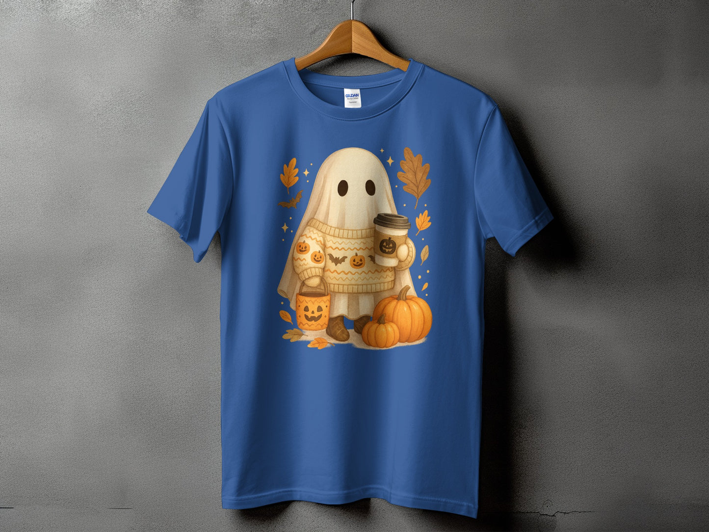 Ghost character in sweater holding coffee, surrounded by pumpkins and autumn leaves.