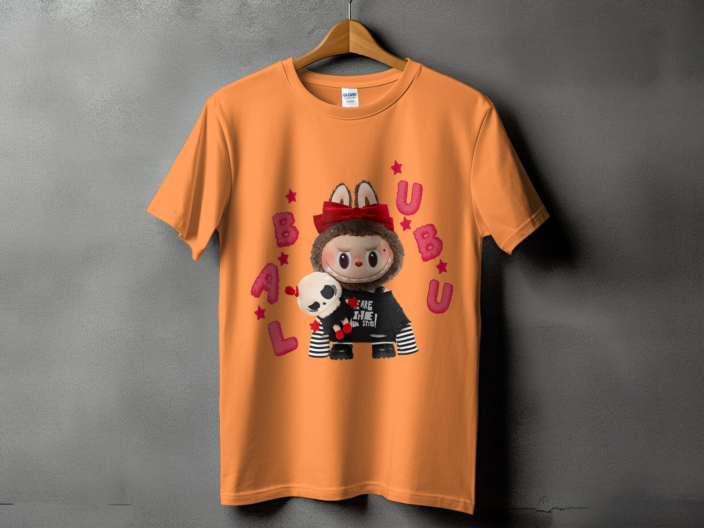 Orange t-shirt with a graphic of a fuzzy creature holding a skull and the text "BEARE THE ON STERS!".