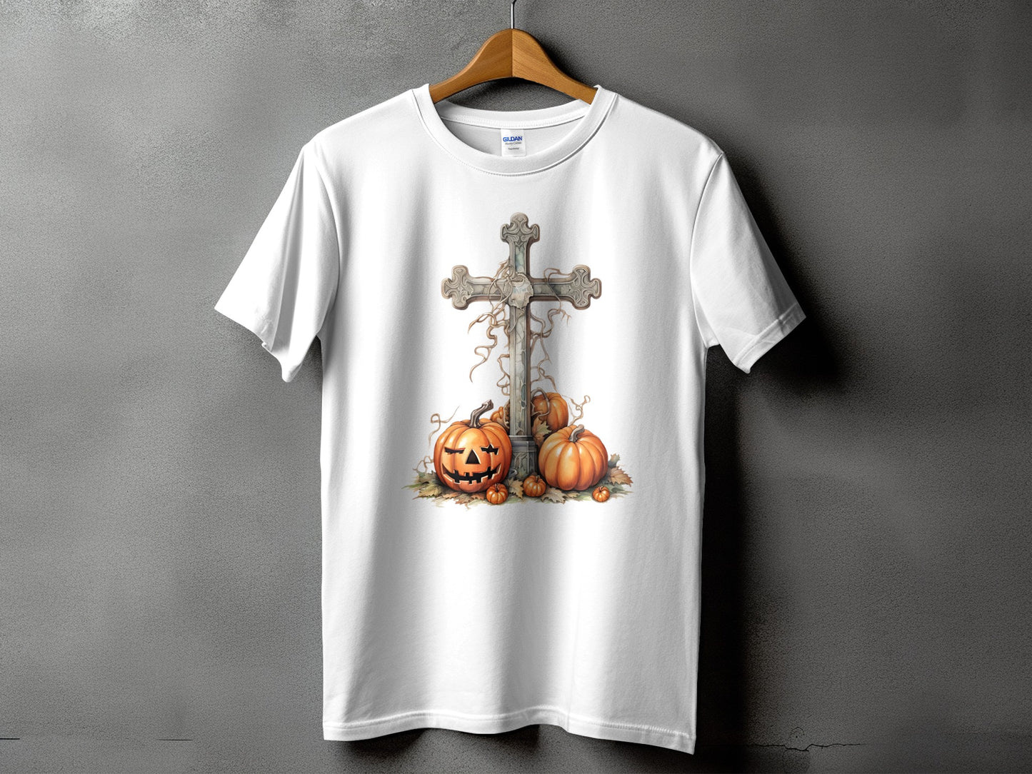 White t-shirt with a distressed cross, pumpkins, and fallen leaves graphic.