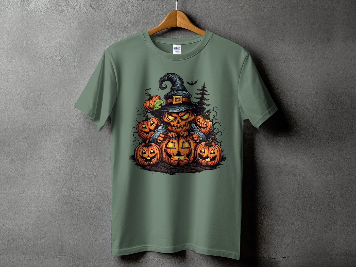 Green t-shirt with a Halloween graphic featuring a jack-o'-lantern in a witch hat surrounded by smaller pumpkins.