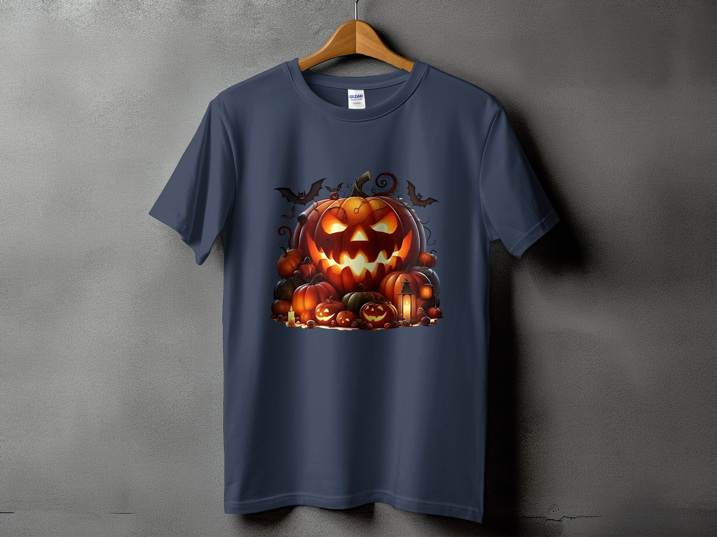 Dark blue t-shirt with a Halloween pumpkin graphic featuring bats and jack-o'-lanterns.