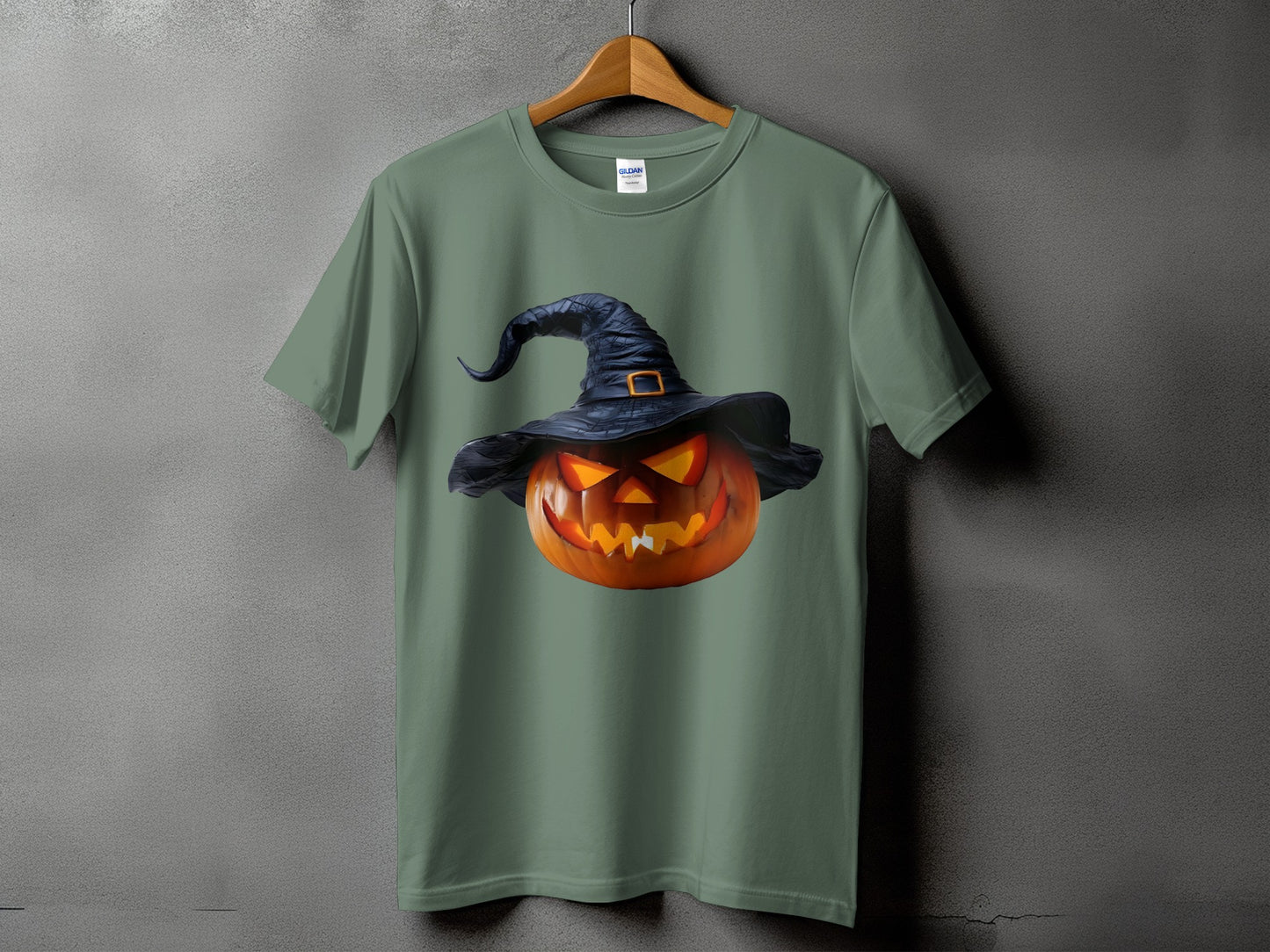 Green t-shirt with a jack-o'-lantern wearing a witch hat graphic.