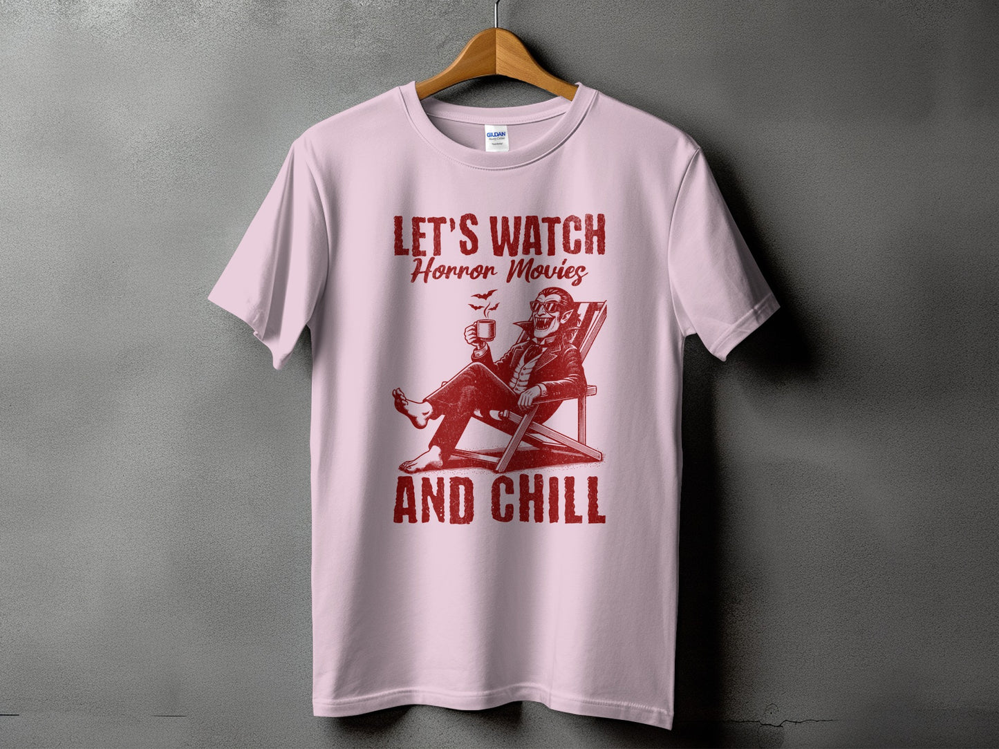 Pink t-shirt with "LET'S WATCH Horror Movies AND CHILL" text and vampire graphic.