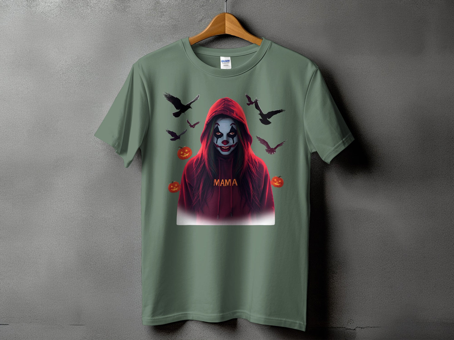 Green t-shirt with spooky clown design, birds, and pumpkins.