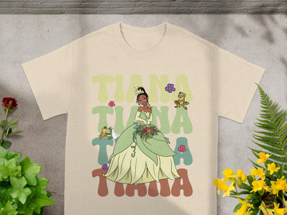 Tiana from The Princess and the Frog in her green ballgown, with cartoon frog and flowers.