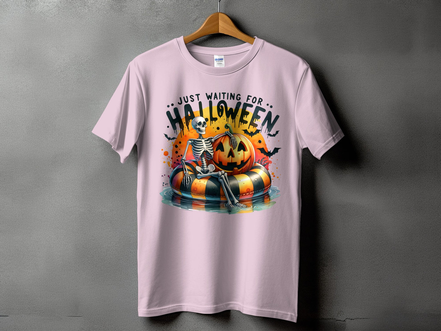 Skeleton on a pumpkin float with text "Just Waiting For Halloween".