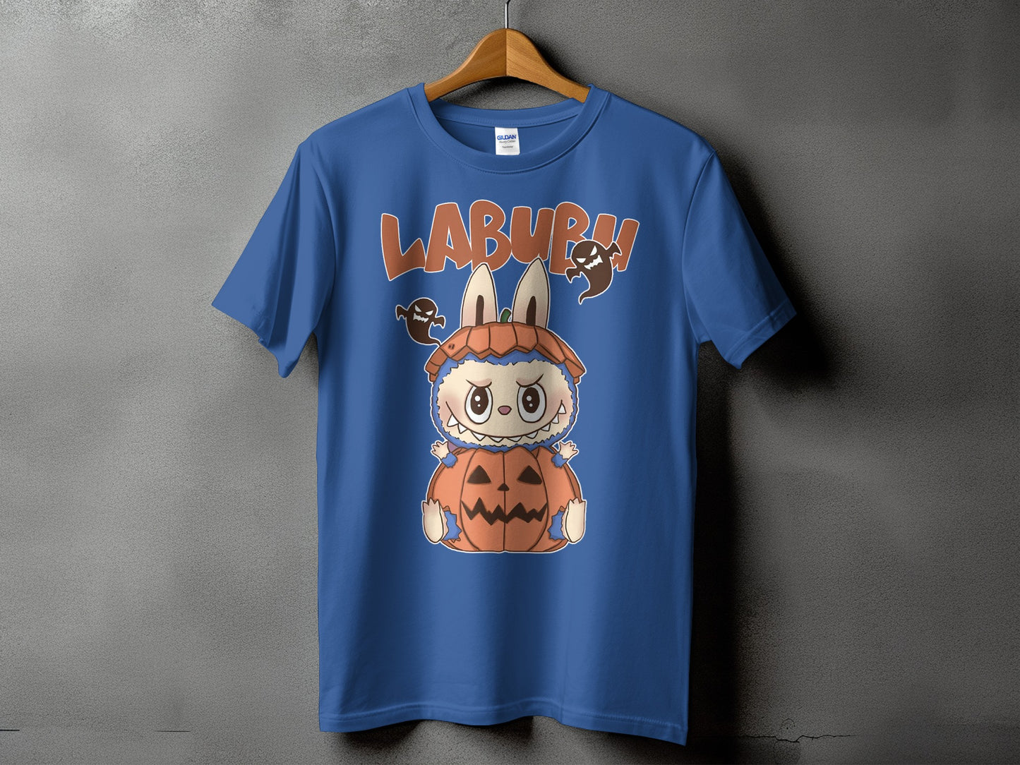 Blue t-shirt with "LABURU" text and a cartoon character in a pumpkin costume.