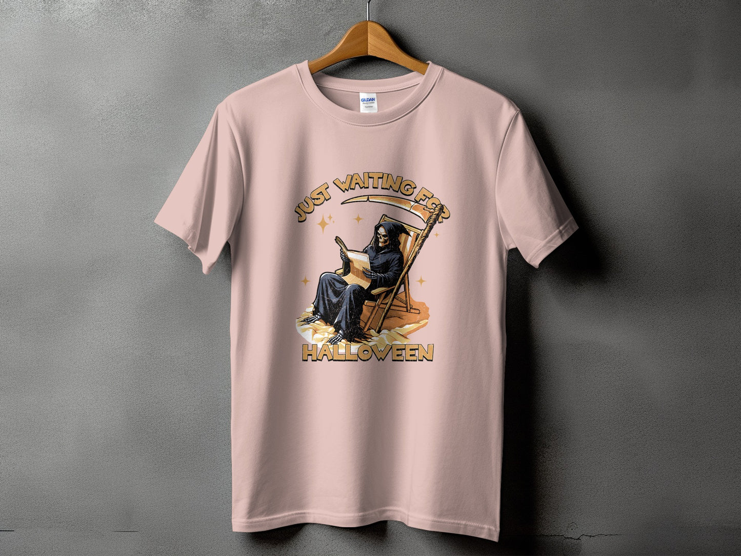 Pink t-shirt with Grim Reaper graphic reading "Just waiting for Halloween."