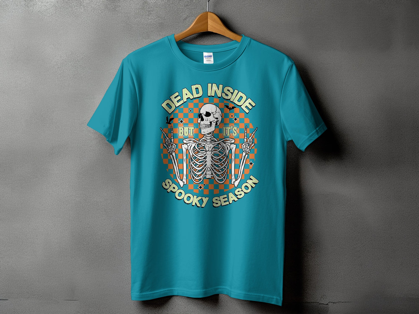Teal t-shirt with skeleton graphic and text "Dead Inside But It's Spooky Season".