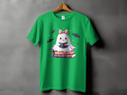 Green t-shirt with a cartoon ghost reading a book surrounded by bats and stars.