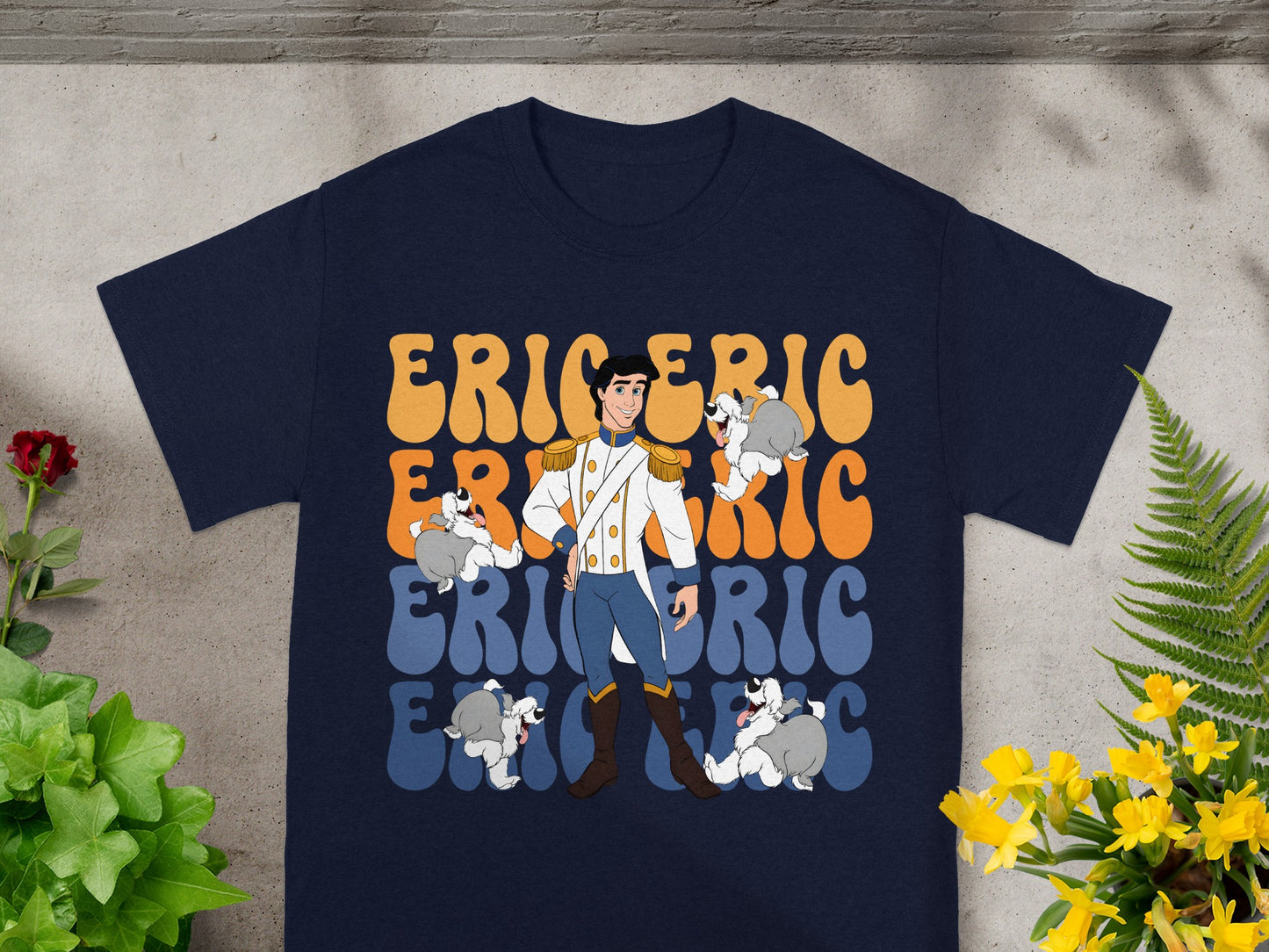 Prince Eric with four dogs on a navy t-shirt with "ERIC" text.