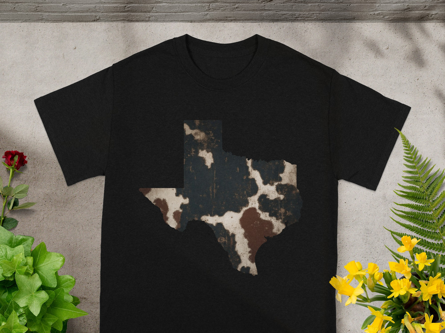 Black t-shirt with Texas shape in cowhide print design.