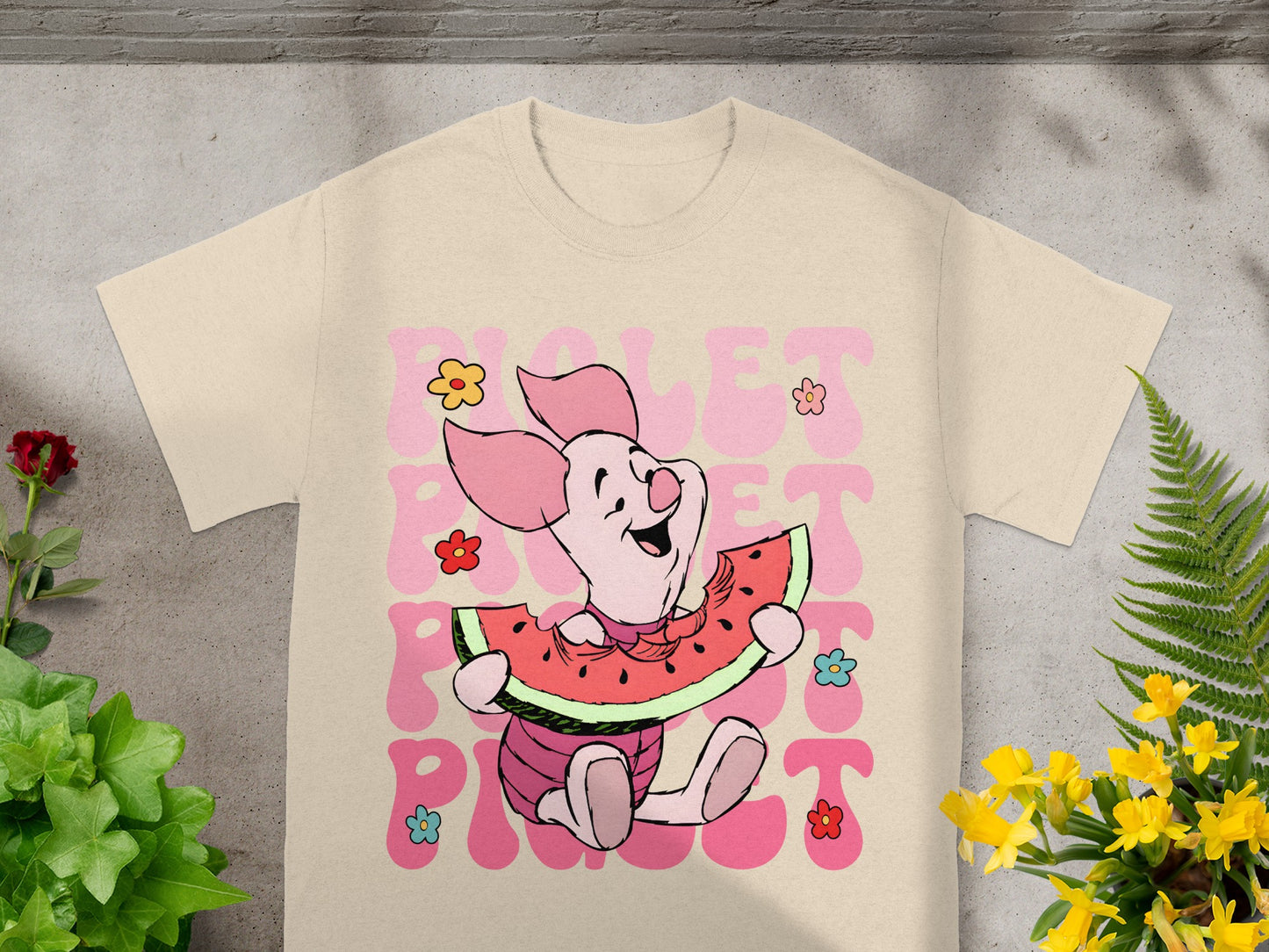 Piglet character from Winnie the Pooh holding a slice of watermelon.