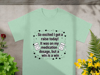 Mint t-shirt with text about a medication dosage raise.