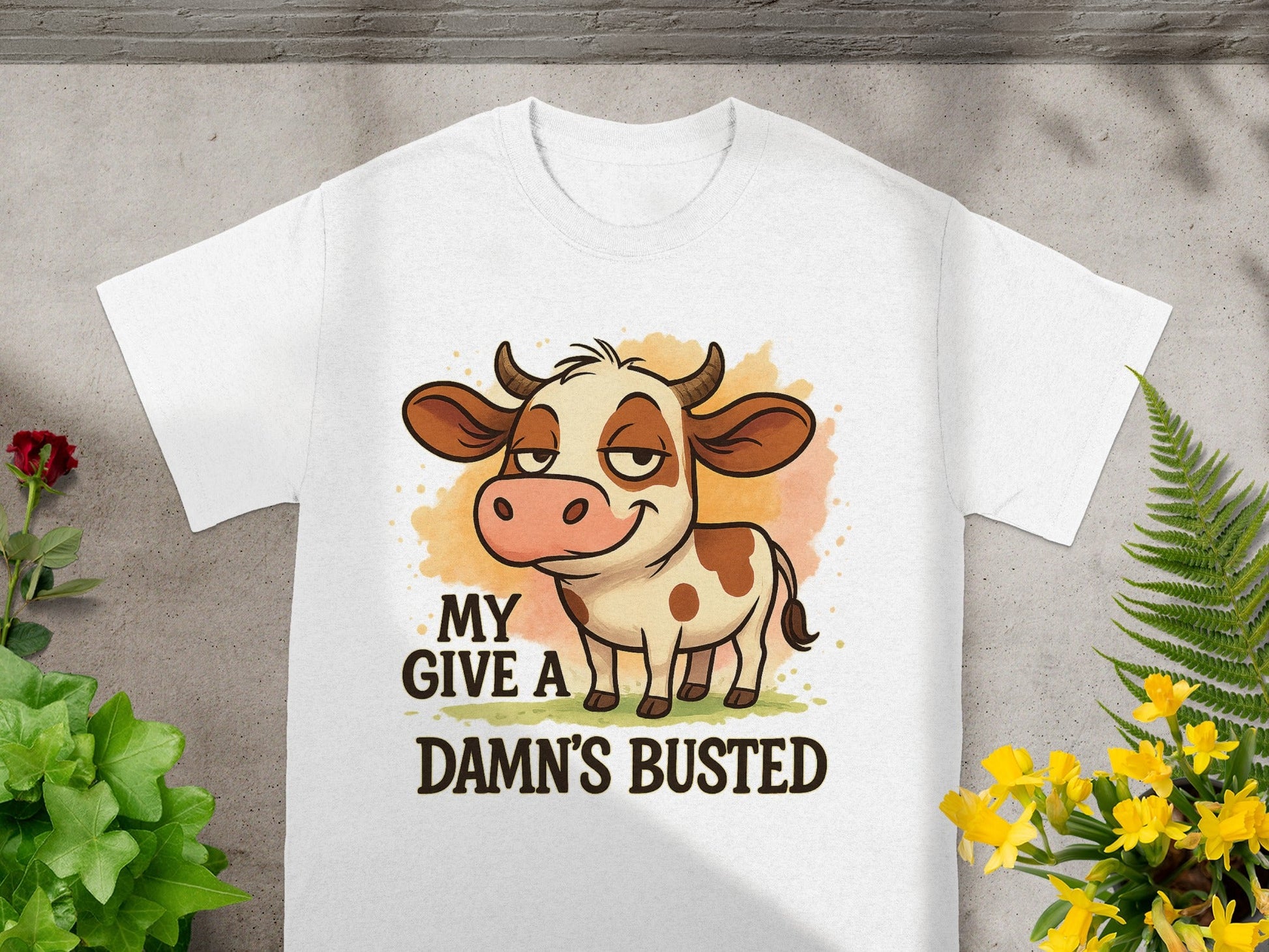 White t-shirt with cartoon cow and text "MY GIVE A DAMN'S BUSTED".