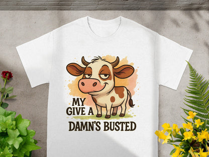 White t-shirt with cartoon cow and text "MY GIVE A DAMN'S BUSTED".