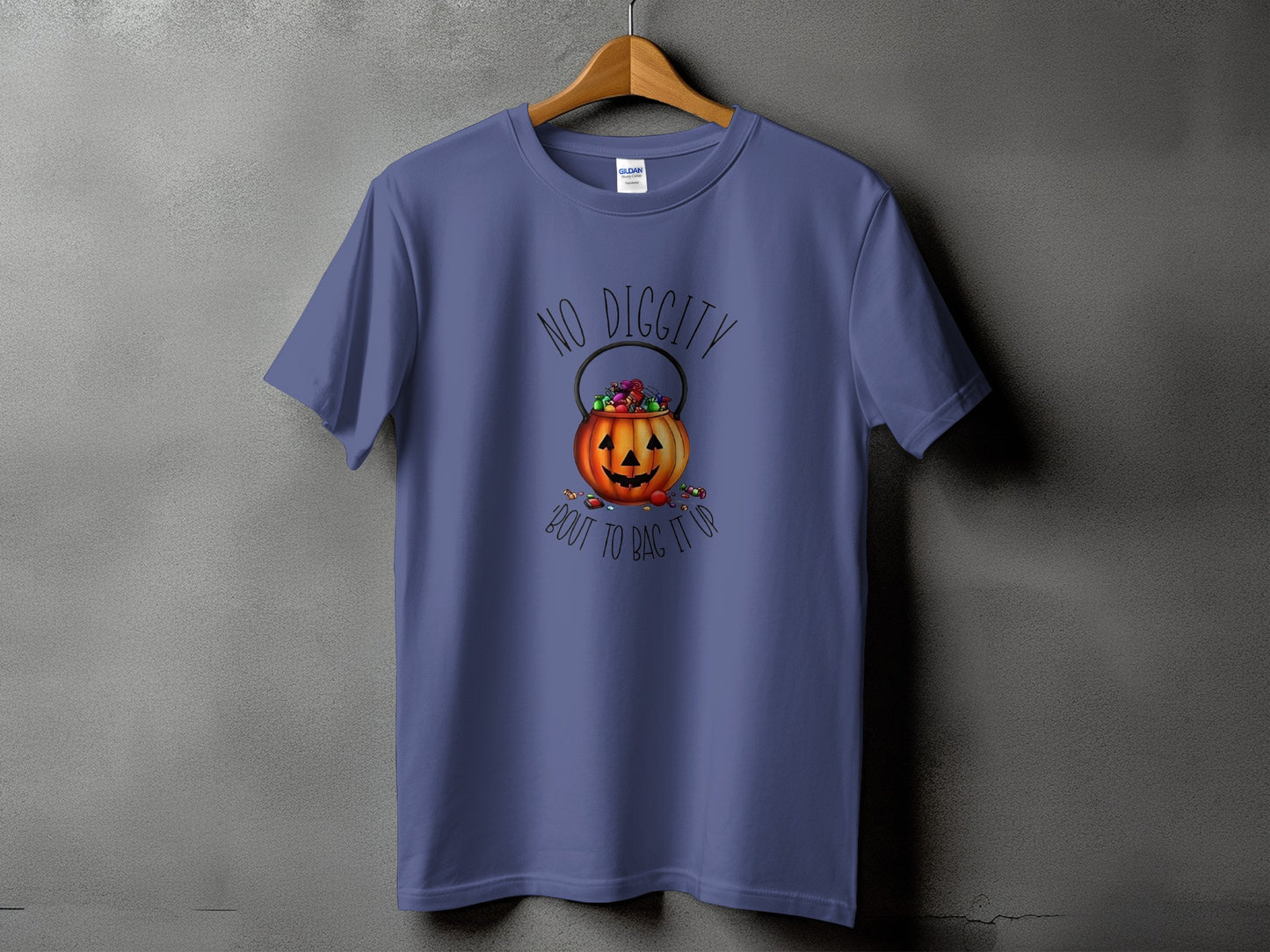 Purple t-shirt with a Halloween pumpkin bucket overflowing with candy.