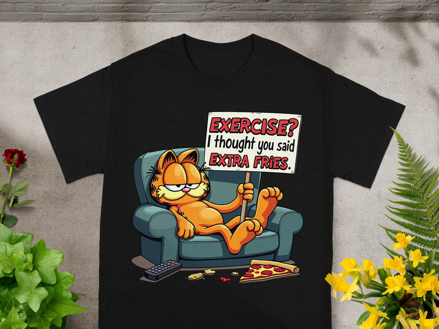 Garfield on couch with "EXERCISE? I thought you said EXTRA FRIES" sign.