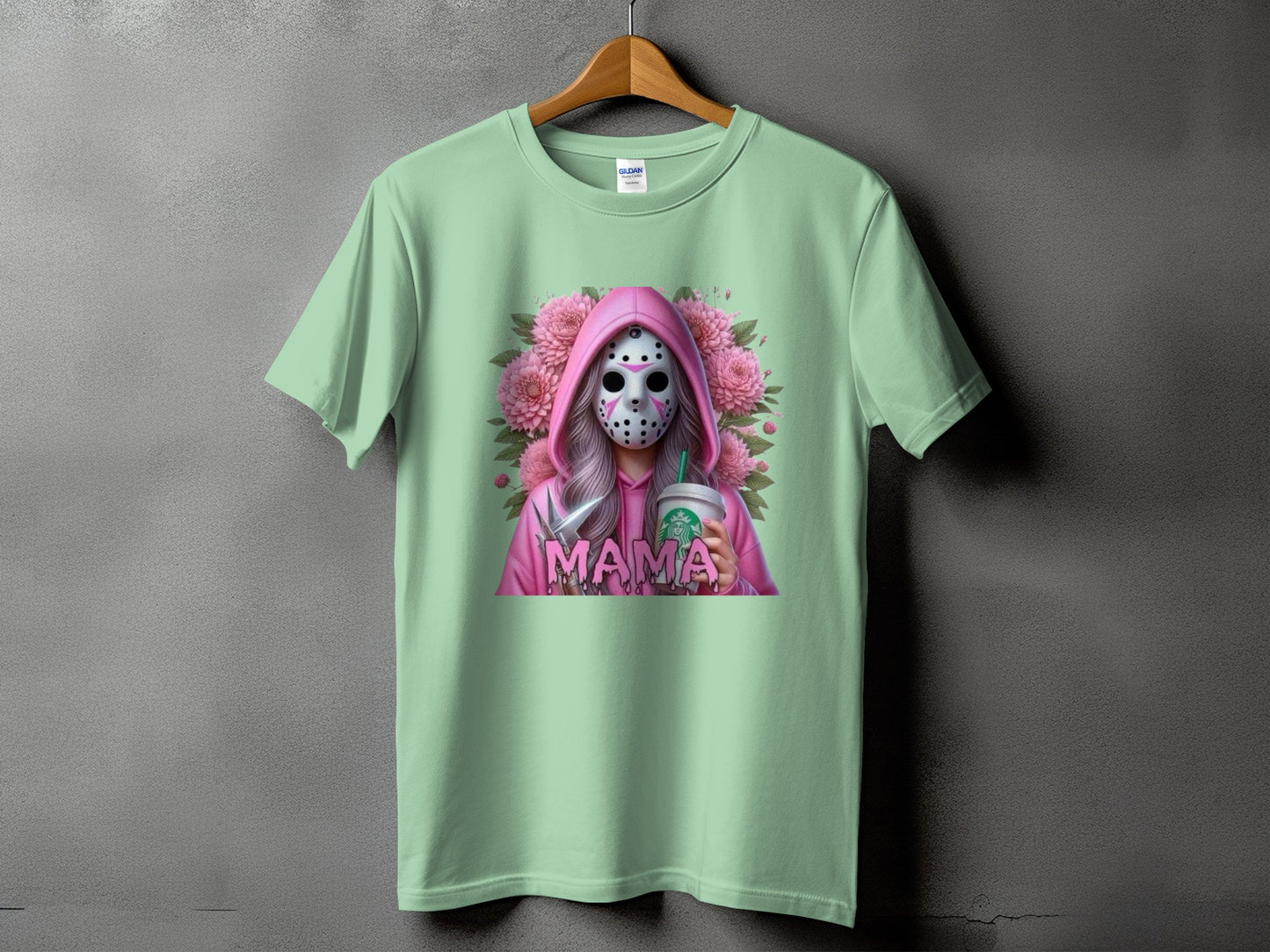 Mint t-shirt with a pink hooded figure wearing a mask, holding a Starbucks cup.