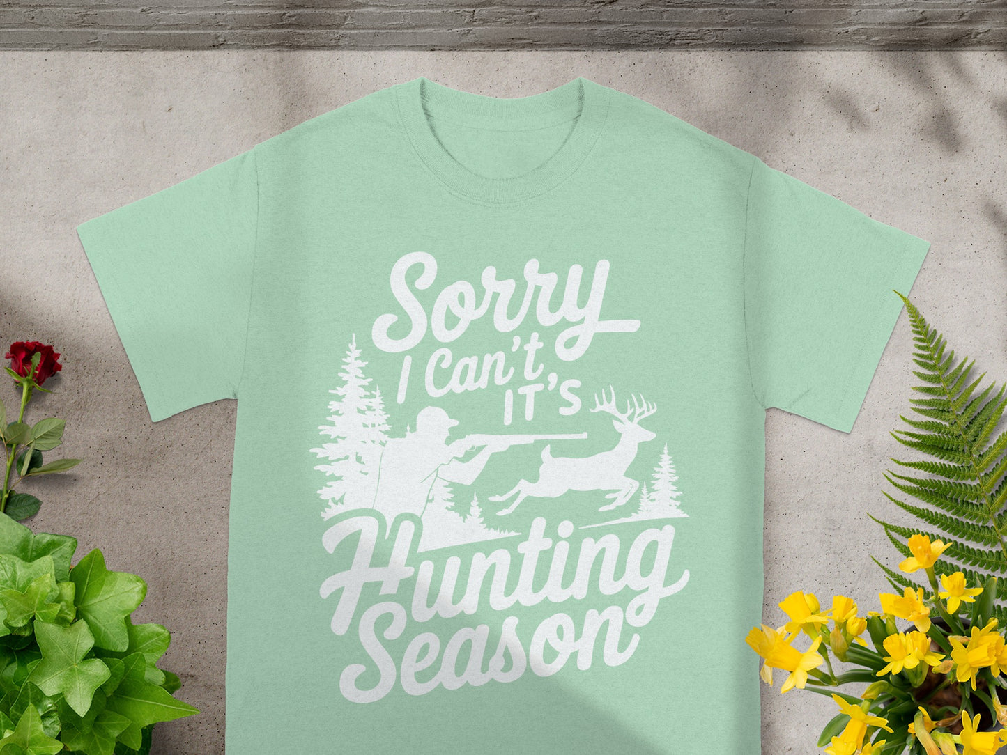 Mint t-shirt with "Sorry I Can't It's Hunting Season" text and deer hunting graphic.