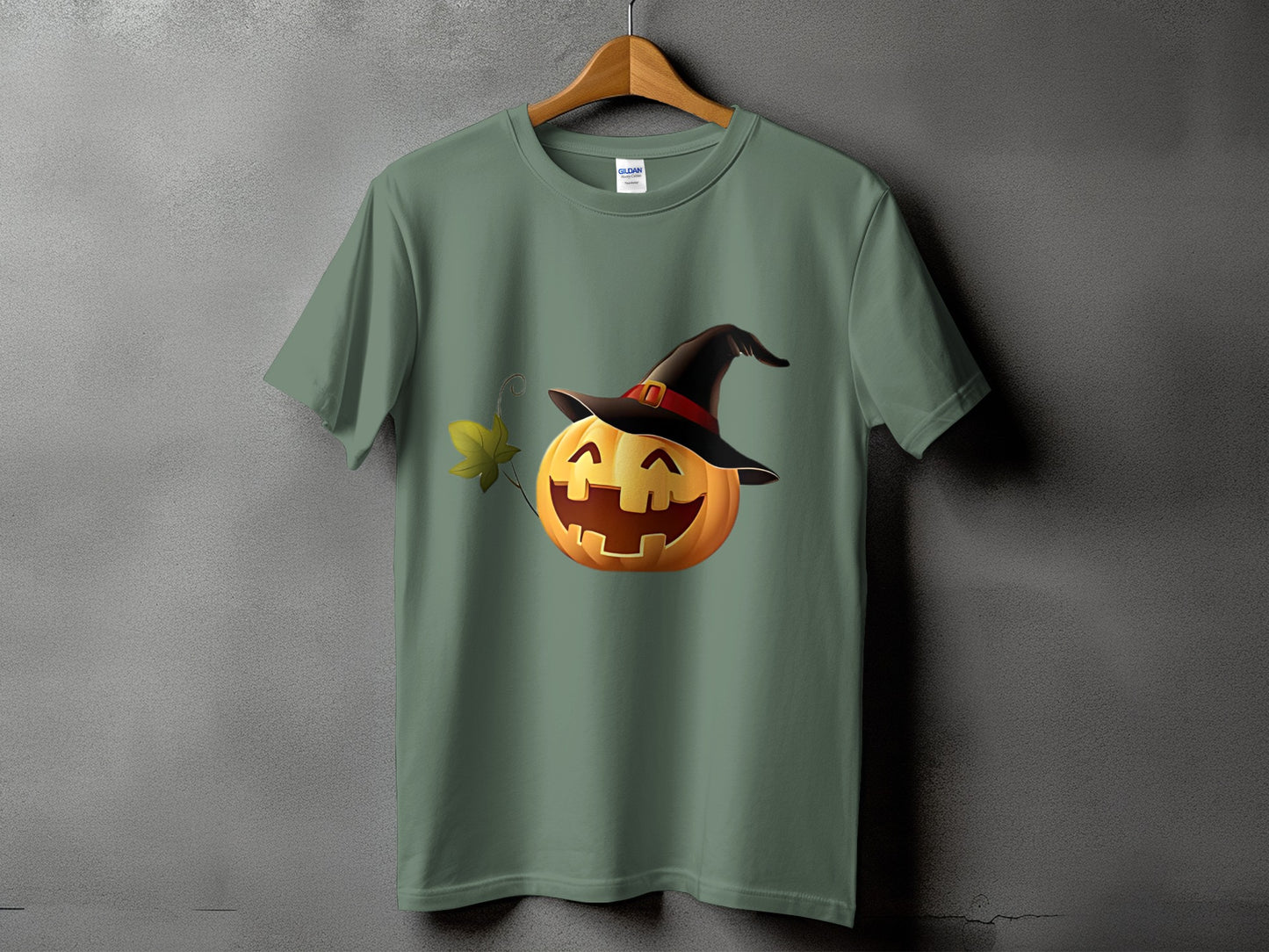 Green t-shirt with a smiling jack-o'-lantern wearing a witch's hat.