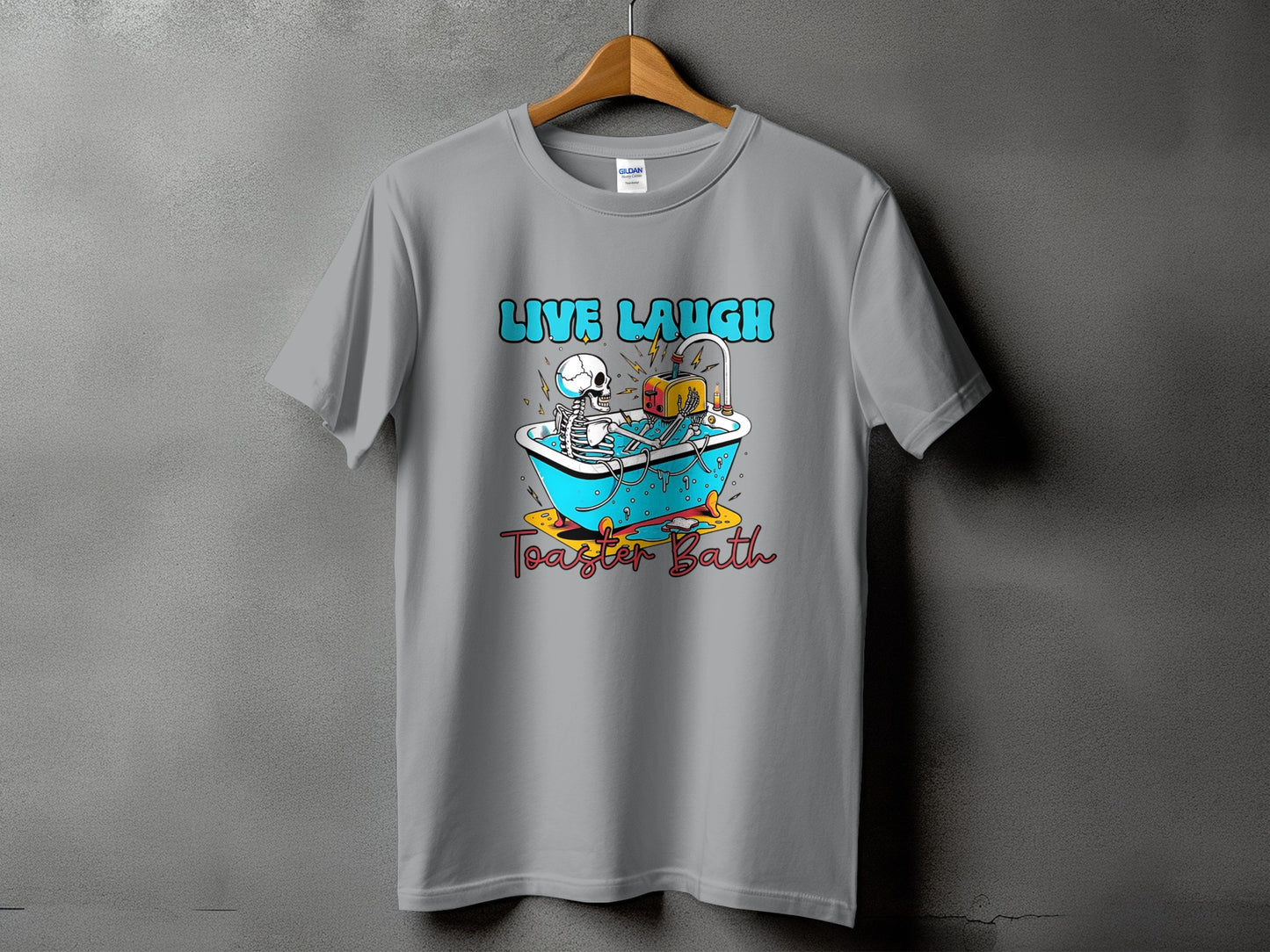 T-shirt graphic with skeleton in bathtub and text "Live Laugh Toaster Bath".
