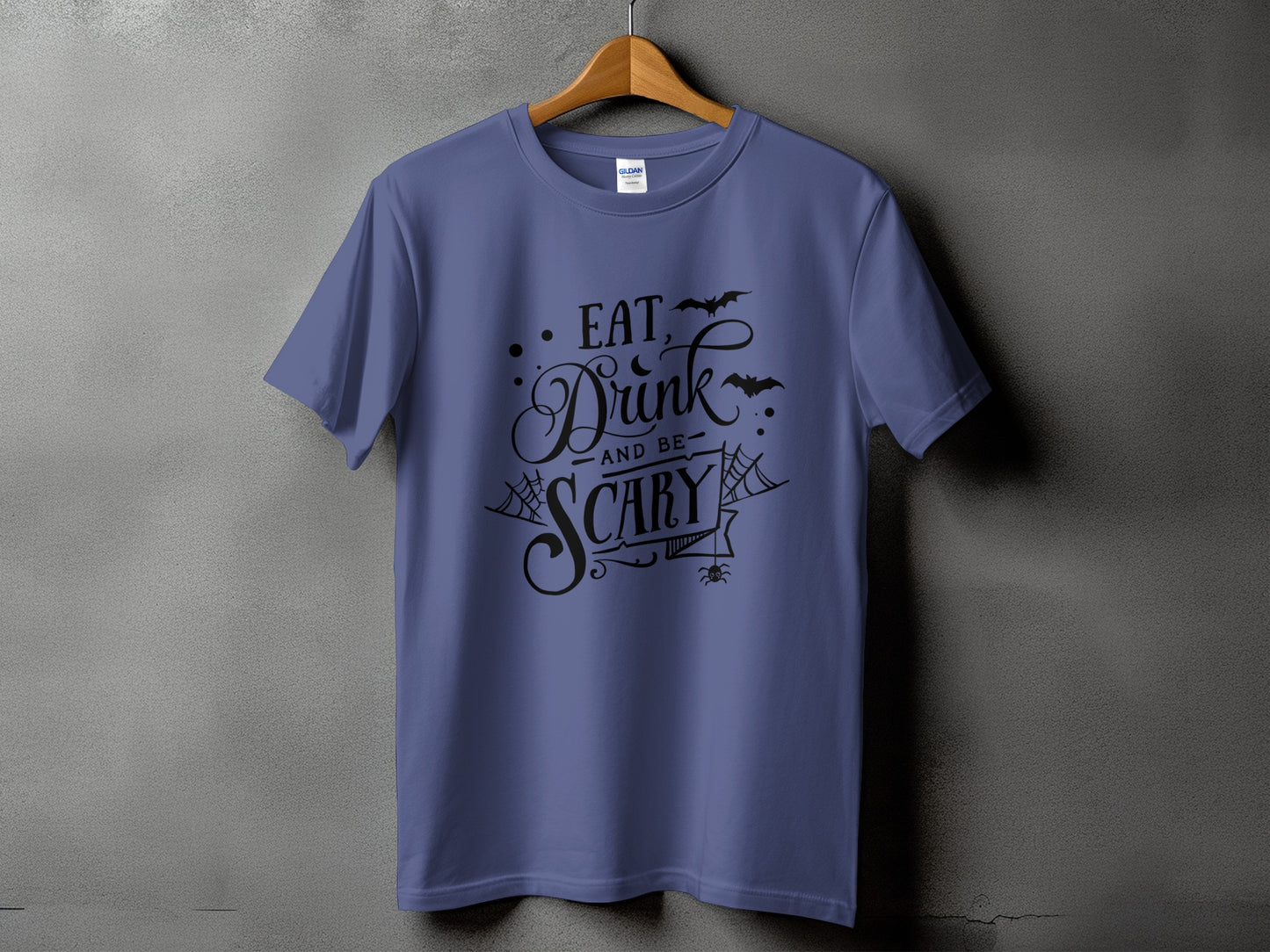 Purple t-shirt with "Eat, Drink, and be Scary" Halloween graphic and bats.
