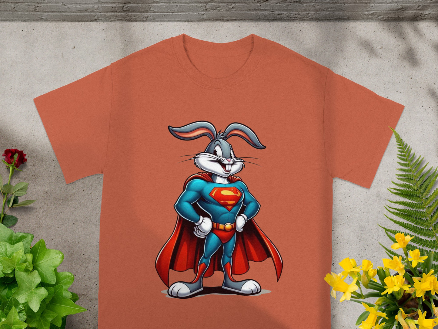 Bugs Bunny as Superman with hands on hips, on an orange t-shirt.