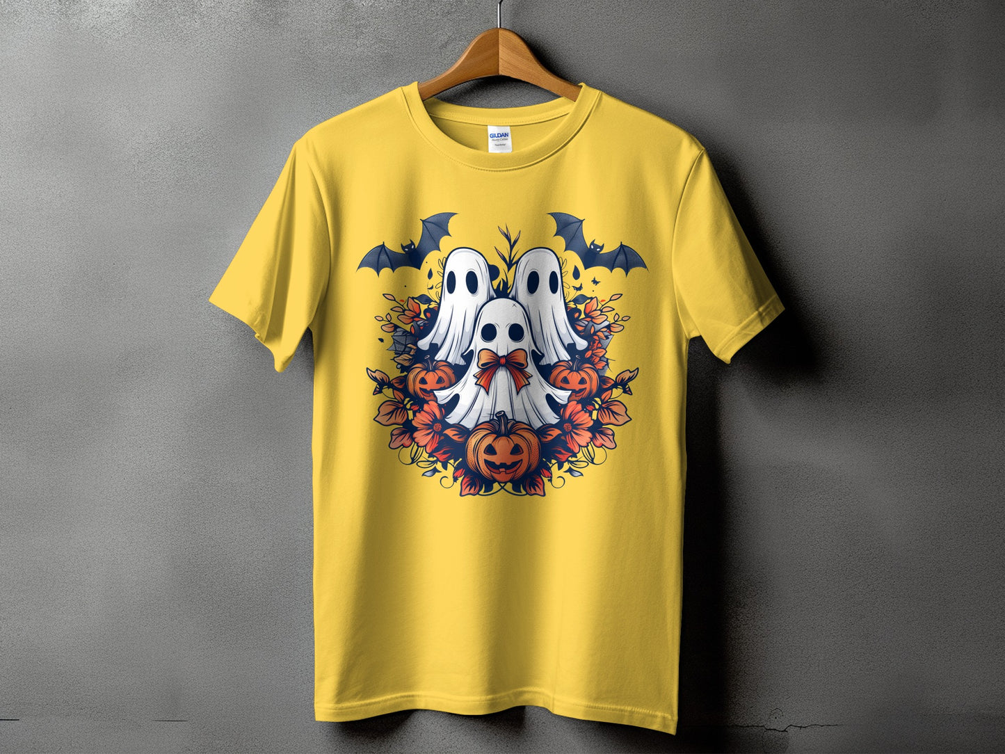 Yellow t-shirt with a Halloween graphic of three ghosts, bats, and pumpkins.