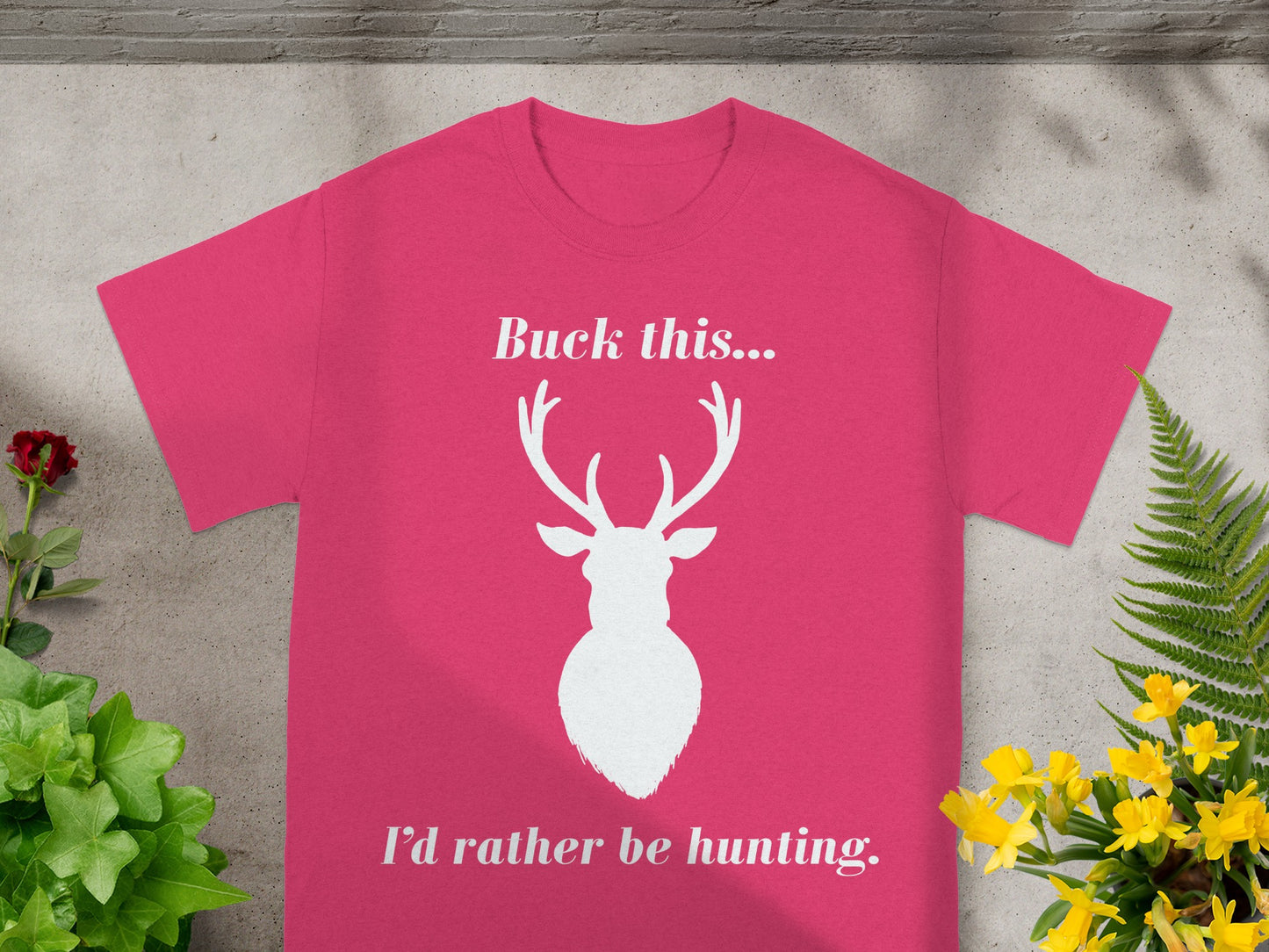 Pink t-shirt with white text "Buck this... I'd rather be hunting." and deer silhouette.