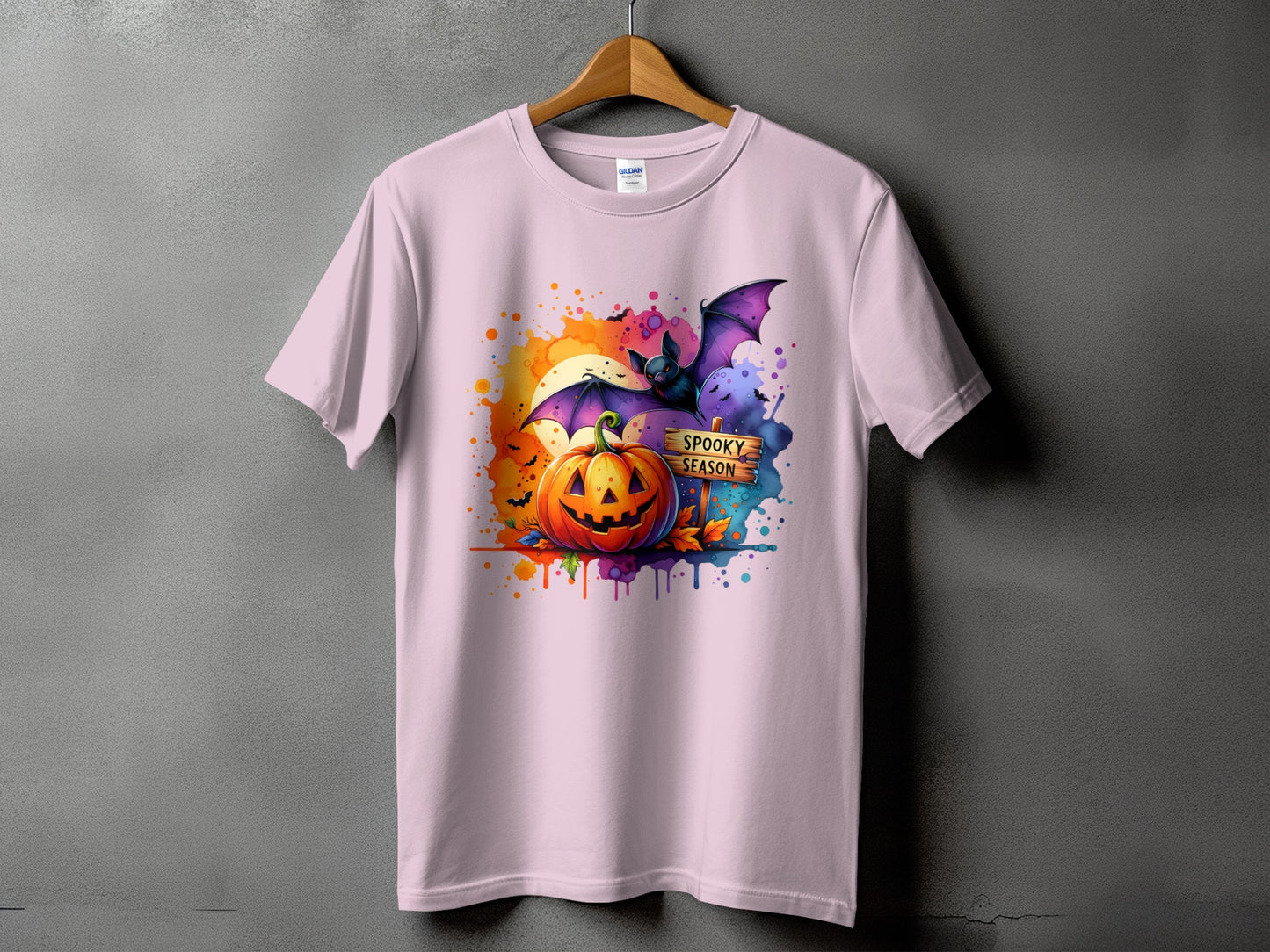 Halloween t-shirt with jack-o'-lantern, bat, and "Spooky Season" sign.