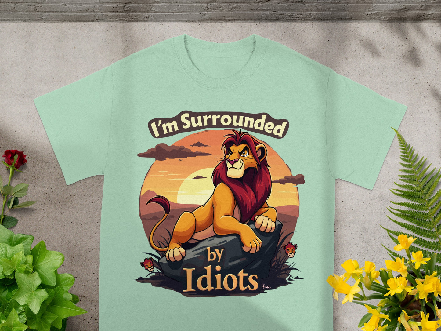 Mint t-shirt with a lion and "I'm Surrounded by Idiots" text.